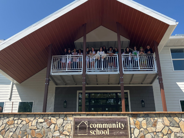 Students standing on the balcony of the new building.