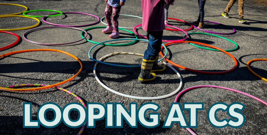 Hula hoops on the ground with kids lower body jumping in the circles.